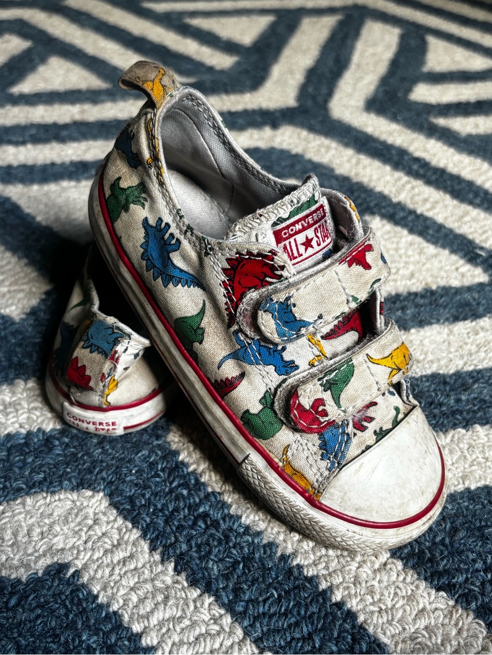 Converse Kids White Canvas Sneakers with Red, Blue, Green, Yellow Dinosaur Print